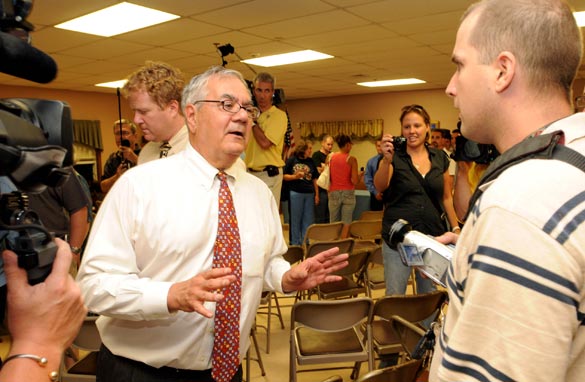 Rep. Barney Frank (D-MA) (L) argues with a man following a town hall meeting August 18, 2009 at the Dartmouth Council on Aging in Dartmouth, Massachusetts. (Photo by Darren McCollester/Getty Images)