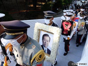 Honor guard soldiers carry the coffin of Kim Dae-jung for burial during his state funeral on August 23 in Seoul.