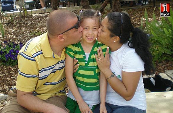 TSgt Royston Wilson, TSgt Rosanna Wilson and their daughter.