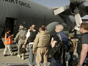 The crew boards a C130 at ISAF Kabul airbase. 