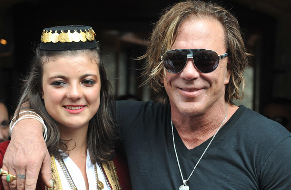 Hollywood actor Mickey Rourke with a Bosnian woman wearing traditional dress in Sarajevo. (PHOTO: AFP/Getty Images)