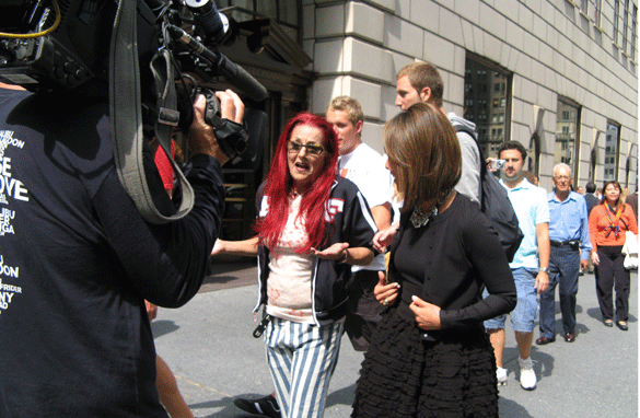 Patricia Field and Alina Cho walk down Fifth Avenue.