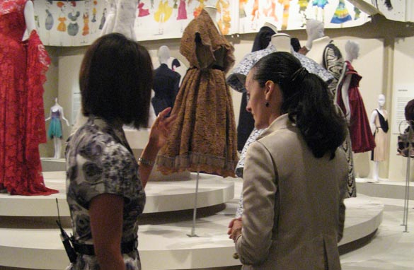 Alina Cho inquires about the different pieces on display.