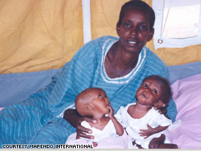 Rose and her twins in Congo in 2000.