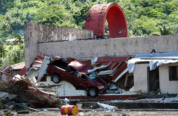 This photo taken on September 29, 2009 after an 8.0-magnitude quake and tsunami struck in the early morning offshore shows a damaged building and truck in Pago Pago, on American Samoa. (JOHN NEWTON/AFP/Getty Images)