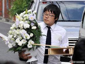 A man delivers flowers to Nakagawa’s home.