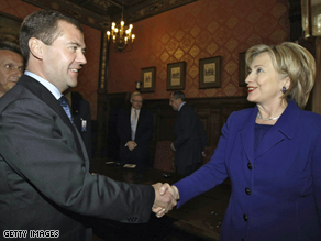 Russian President Dmitry Medvedev shakes hands with Secretary of State Hillary Clinton outside Moscow. 