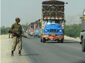 Pakistani soldier patrols military logistics route out of South Waziristan on October 24.