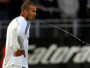 Footballers cannot spit in face of swine flu