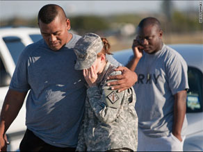 Soldiers gather outside of Fort Hood.