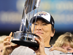 Hideki Matsui celebrates with the World Series MVP trophy at Yankee Stadium on November 4, 2009.