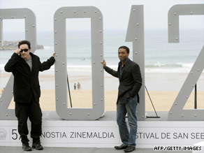 Actors John Cusack and Chiwetel Ejiofor pose to promote Emmerich's latest film 2012.