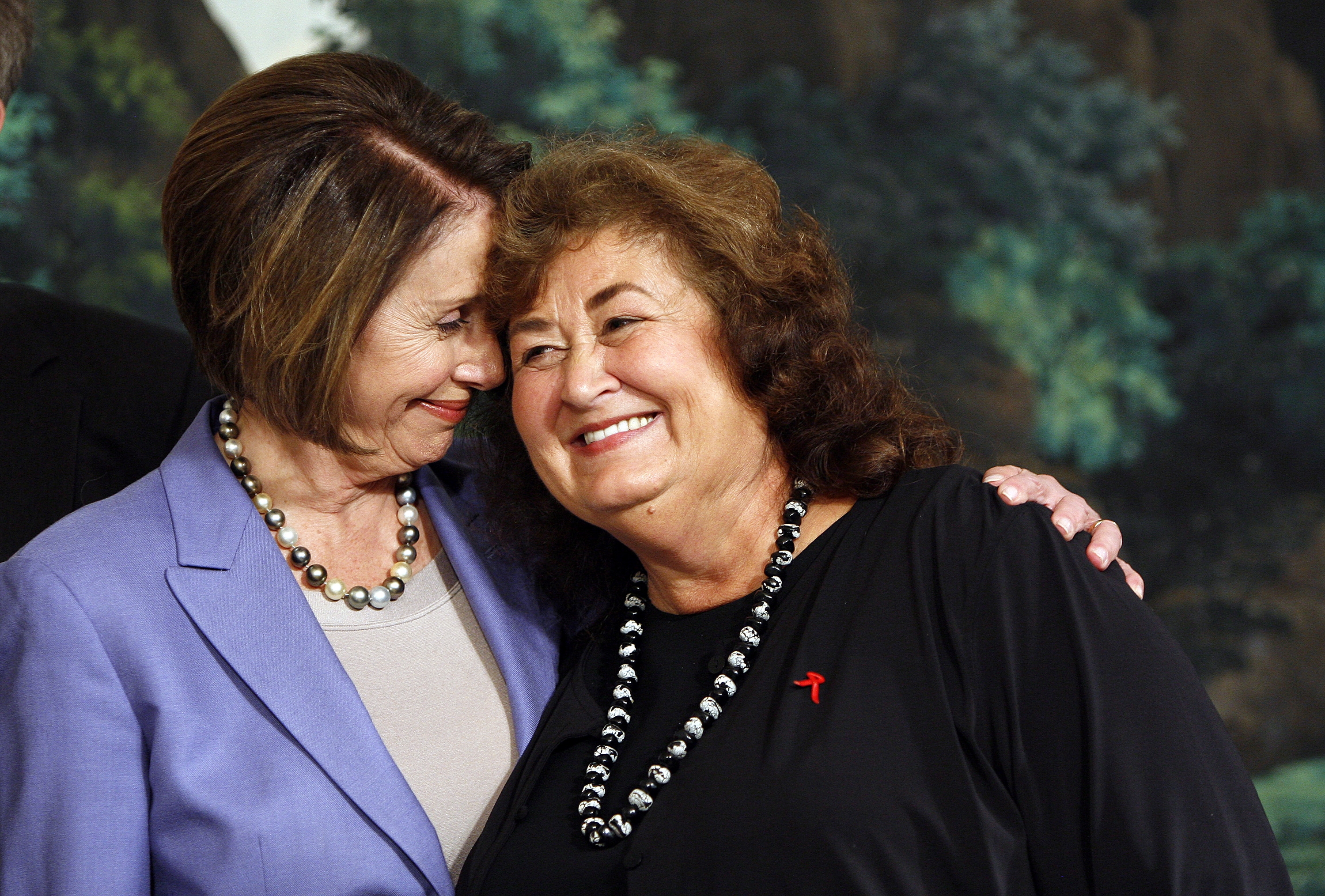 Ryan white’s mother, Jeanne White Ginder, with Speaker of the House, Nancy Pelosi, on the day President Obama signed the Ryan White HIV/AIDS treatment extension act of 2009. (Photo by EPA)