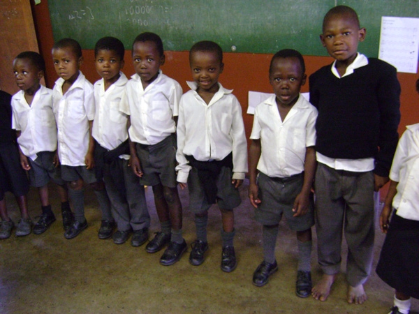 Students in Thanda After-School's Youth Education Program line up before going outside to play a game.