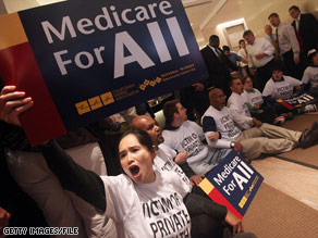 Health care reform supporters participate in a sit-in inside the lobby of a Manhattan building.