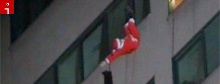 Here comes rappelling Santa Claus