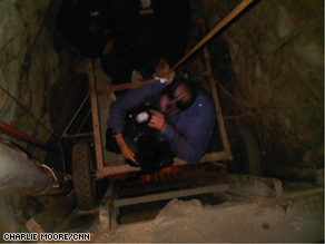 CNN photojournalist Neil Hallsworth takes a dummy car down 90 feet into the tunnel.