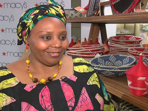 Janet Nkubana, a former refugee from Rwanda, sells baskets for a company she founded that now employs more than three thousand Rwandans.