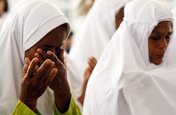  Women attend a mass prayer for victims of the 2004 tsunami on Friday in Banda Aceh, Indonesia. 