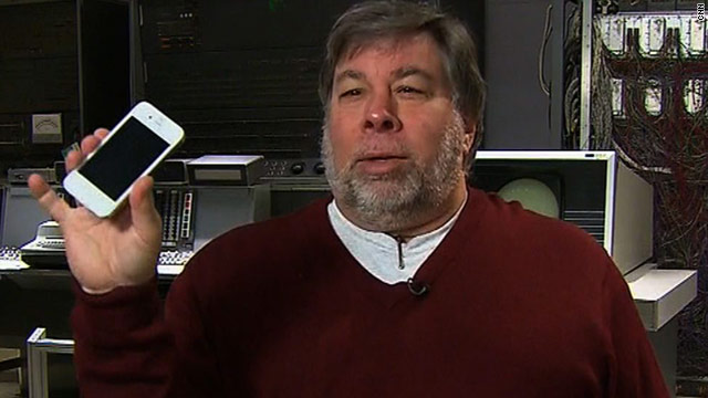 Apple co-founder Steve Wozniak shows off his white iPhone 4, a much-anticipated model that still eludes average consumers.