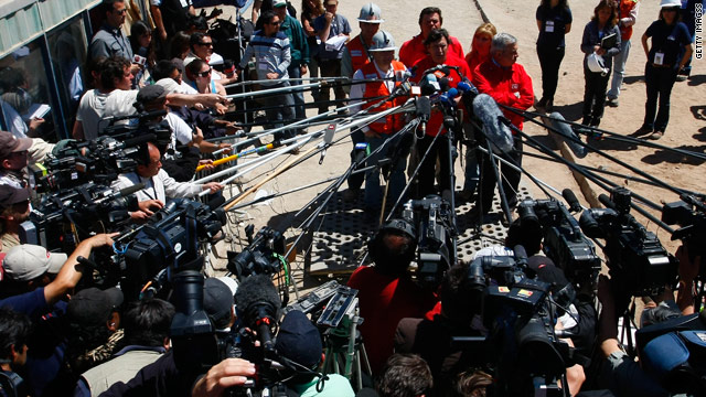 Media members surround Chile mining minister Laurence Golborne Tuesday. Interest online in the rescue has been intense.