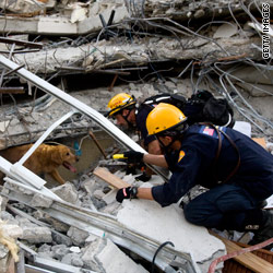 Crews dig through rubble as quake relief takes shape 