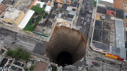 http://i2.cdn.turner.com/cnn/2010/WORLD/americas/06/01/central.america.storm.deaths/c1main.guate.sinkhole.afp.jpg