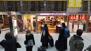 International travelers, such as these at Berlin’s Tegel Airport, face tightened security.