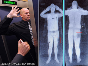 An airport staff member demonstrates a full body scan.
