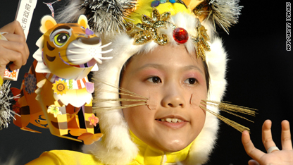  A girl dresses as the Chinese zodiac figure of the tiger.