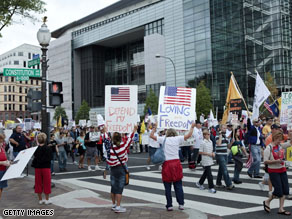 Protesters march at a Tea Party Express rally in Washington, DC.
