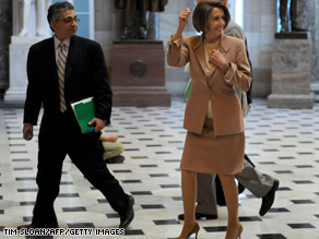 House Speaker Pelosi walks through the Capitol. The House is expected to cast its verdict on a Senate bill Sunday. A 'yes' vote would enshrine into law comprehensive health care reform, bringing coverage to 32 million Americans who currently lack insurance.