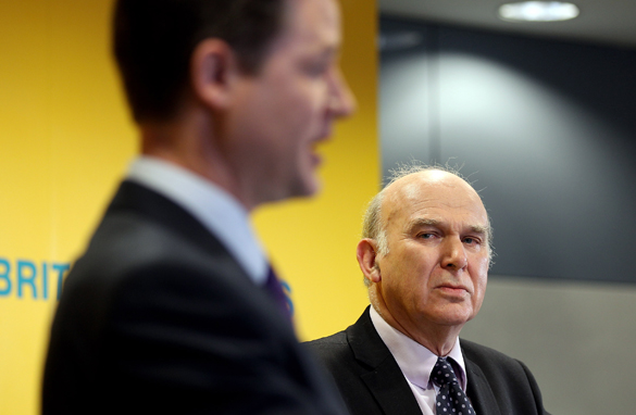 Liberal Democrat leader Nick Clegg (left) with economics chief, Vince Cable April 14 in London. (Getty Images)