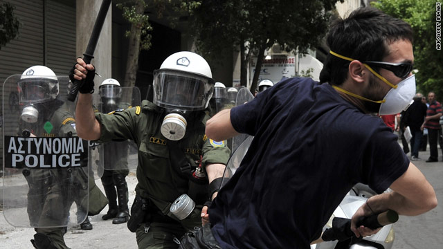 Protesters clash with riot police in Athens on Wednesday.