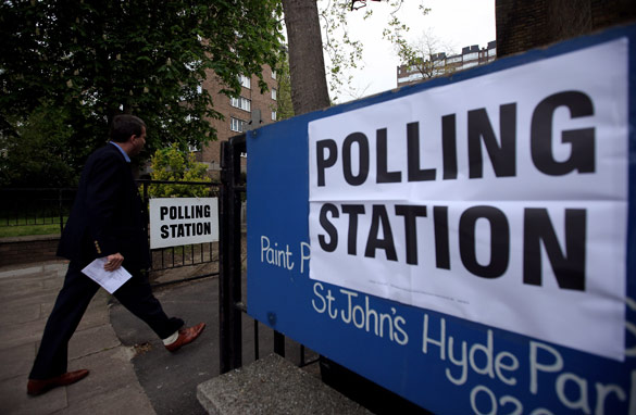 A man arrives at a polling station at St Johns Parish Church, London to cast a vote in the UK election (Getty)