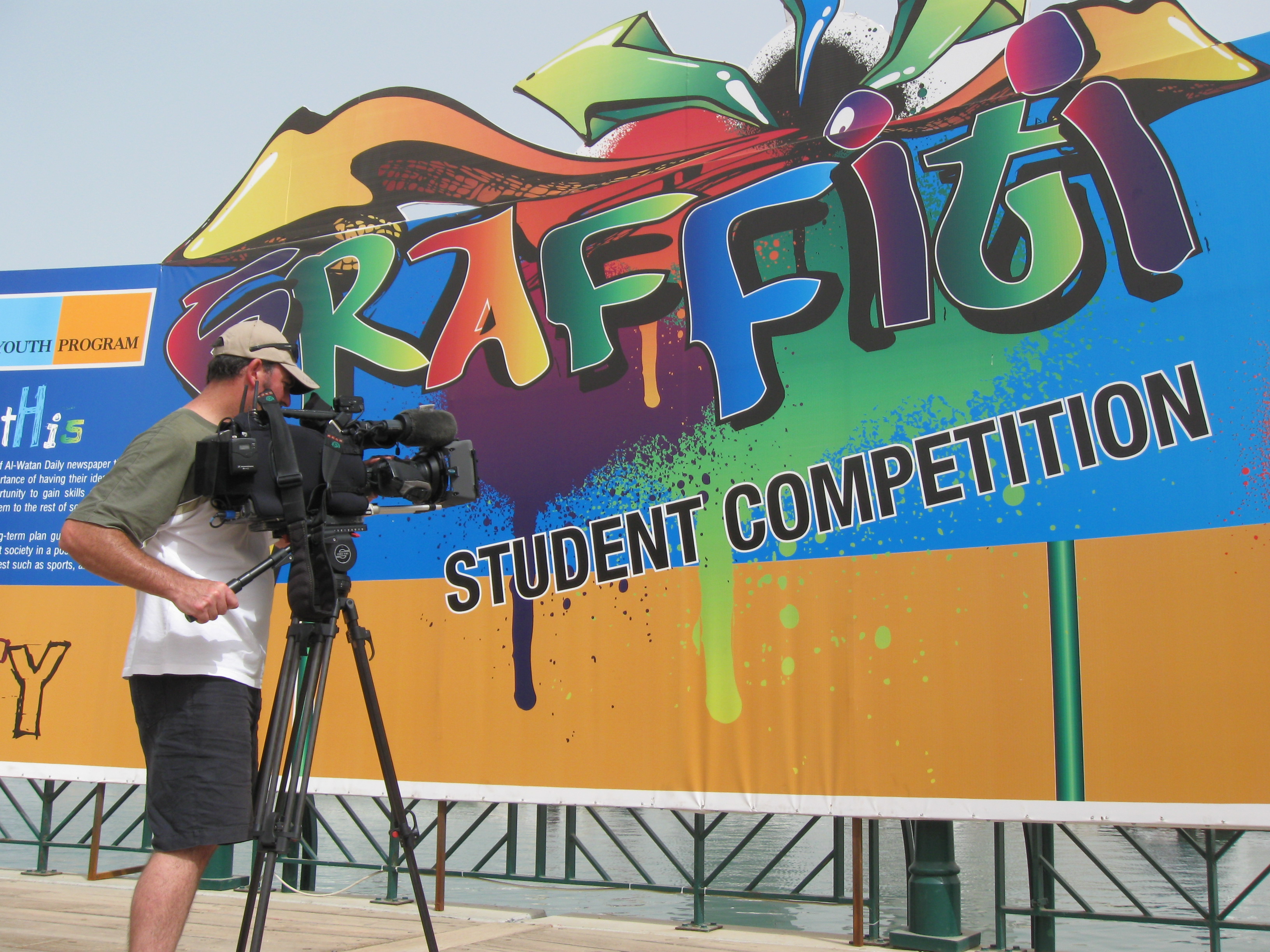 Cameraman James Stacey getting footage of the Graffiti Student Competition, part of the Al-Watan Daily Youth Initiative.