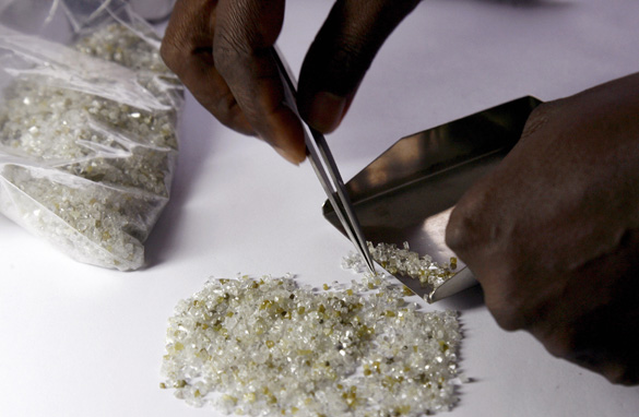 Raw diamonds are checked for their quality. Photo courtesy of  AFP/Getty Images.