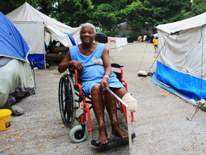 Irese Dossa, 85, says the mirror she’s holding will finally help her get rid of the cramps in her missing leg. Photo by Tamara Fitzpatrick