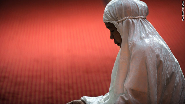 A Muslim women in Indonesia praying as Ramadan starts. We want to know what it means to you to be a Muslim.
