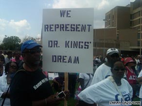 A man holds a sign at the ‘Restoring the Dream’ rally in Washington on Saturday.