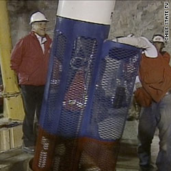 Crews conduct the last tests on a rescue capsule that will bring 33 trapped miners back to the surface.