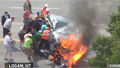 Bystanders lift burning car off man