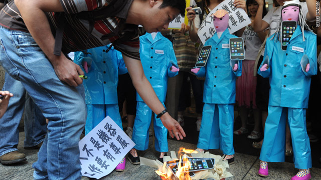 On May 25, students in Hong Kong burn Apple products in effigy to protest conditions at Chinese factories that make them.