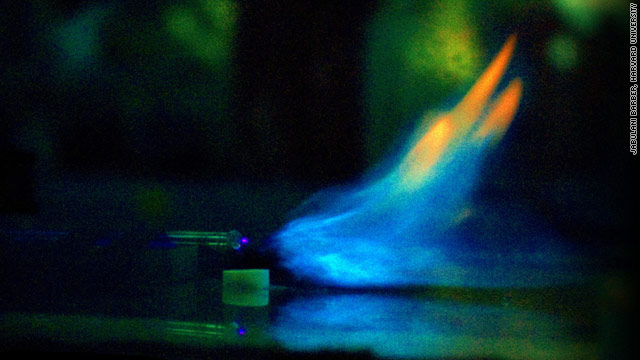 A flame is deflected by an electric field generated by a wire electrode during the study at Harvard University.