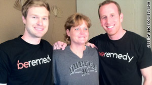 Blake Canterbury, left, and Brian Sudduth smile with Kecia Cruz.