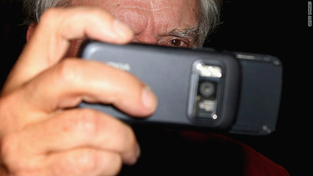 Photographer David Bailey tests a Nokia smartphone, which captures more detailed data than most regular cameras.