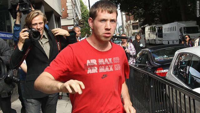 Suspected rioter David O'Neill leaves court Thursday in London after posting bail on charges, including aggravated violence.