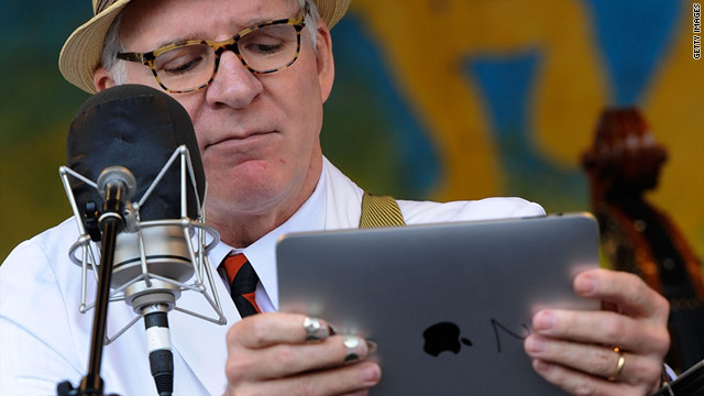 Steve Martin, shown here with his iPad, has been tweeting "from" CES this week.