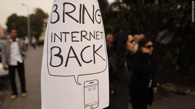 Protesters in Egypt post a sign asking the government to restore internet service, which was restored on Wednesday.