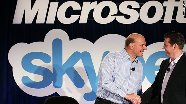 Microsoft CEO Steve Ballmer, left, and Skype CEO Tony Bates shake hands at a news conference Tuesday.